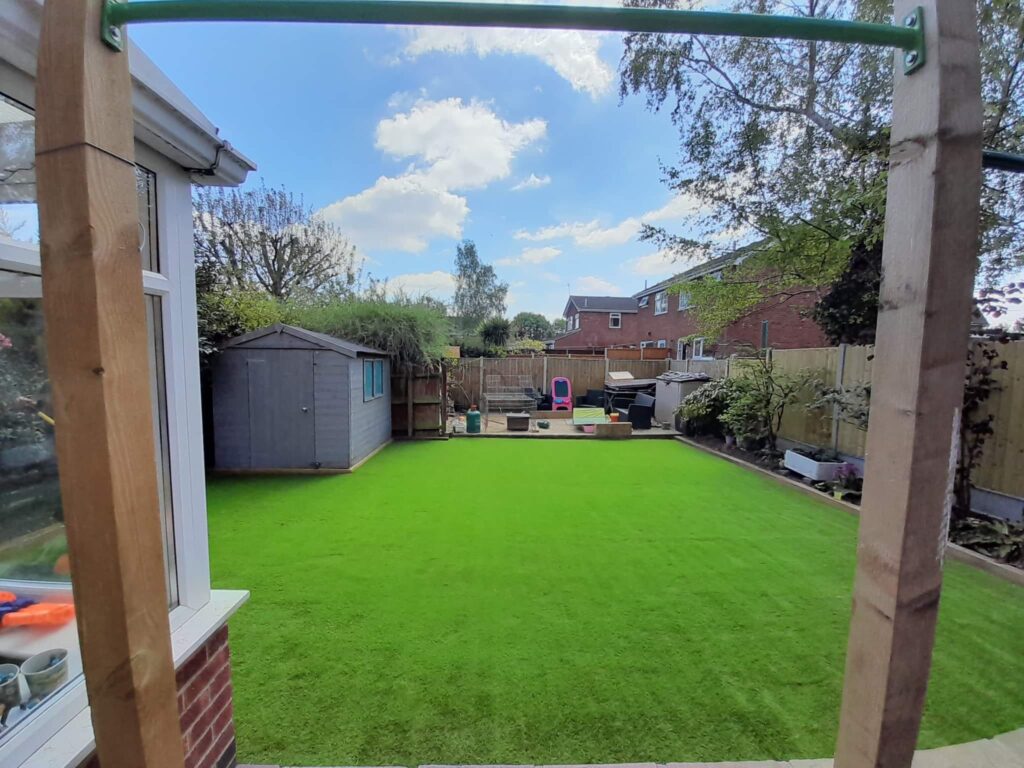 Here is a photo of a back garden in Leicester with recently installed artificial grass. Leicester artificial grass services carried this out