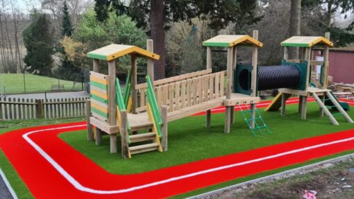 Here is a photo of an outdoor children's play area. Leicester artificial grass services installed the artificial grass